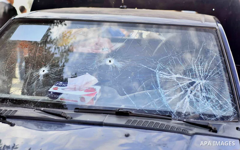 The vehicle is seen at the site where masked gunmen on a motorcycle shot dead four Egyptian policemen south of the capital Cairo, on November 28, 2015. According to the Egyptian interior ministry the gunmen opened fire o...
