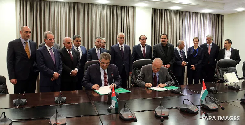Palestinian Prime Minister Rami Hamdallah meets with Jordanian Minister of Education Labib Khadra, in the Wst Bank city of Ramallah on November 30, 2015. Photo by Prime Minister Office