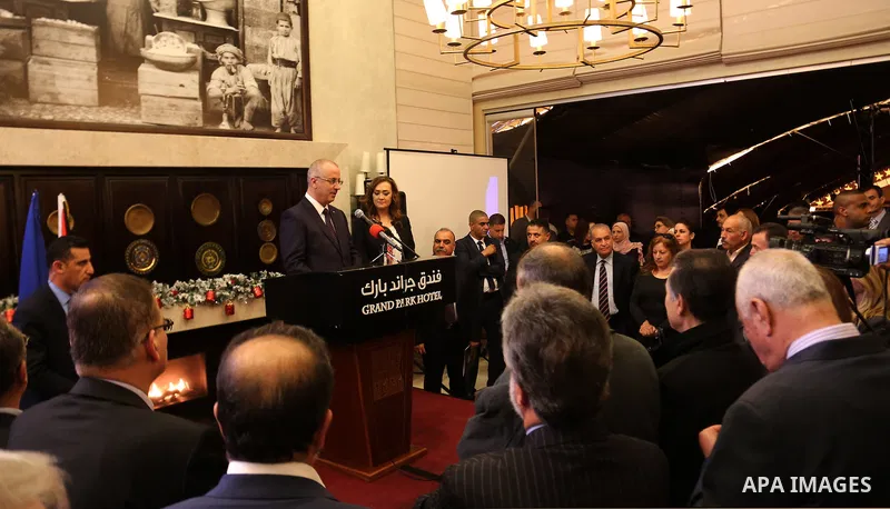 Palestinian Prime Minister Rami Hamdallah fives a speech during a ceremony to mark Romanian National Day, in the Wst Bank city of Ramallah on November 30, 2015. Photo by Prime Minister Office