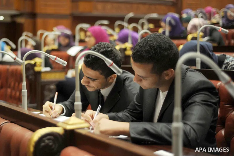 Egyptian students of Cairo University attend a simulation meeting of members of Parliament, at Cairo University on November 30, 2015. Photo by Stringer