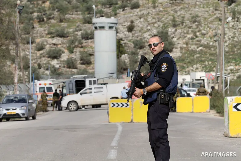 Israeli security forces gather at the Einav checkpoint, east of Tulkarem in the occupied West Bank, where a young Palestinian woman was shot dead after reportedly seeking to stab a soldier on December 1, 2015. Palestinia...