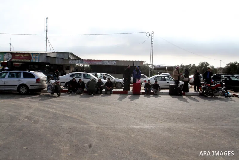 Palestinians wait for permission to enter Egypt at the Rafah border crossing in the southern Gaza Strip, on December 3, 2015. Egypt is due to re-open its Rafah border crossing with the Palestinian coastal enclave for two...