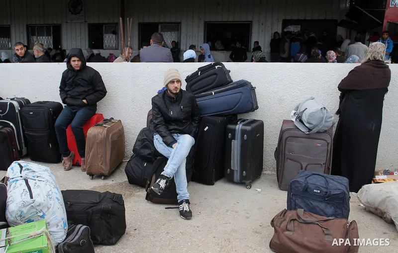 Palestinians wait for permission to enter Egypt at the Rafah border crossing in the southern Gaza Strip, on December 3, 2015. Egypt is due to re-open its Rafah border crossing with the Palestinian coastal enclave for two...