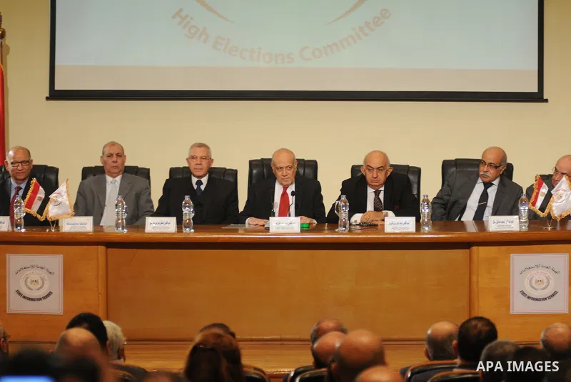 Ayman Abbas, head of the Egyptian election committee, holds a press conference on December 4, 2015 in the capital Cairo. About 28 percent of Egyptian voters cast ballots in a staggered parliamentary election dominated by...