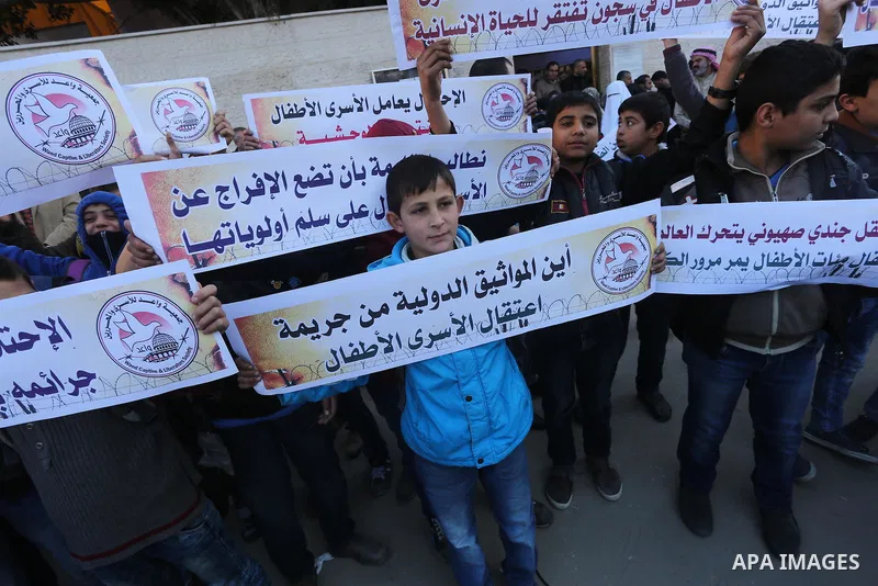 Palestinians take part in a protest demanding release the prisoners in Israeli jails, in front of Red cross office, in Gaza city, on Dec. 07, 2015. Photo by Mohammed Asad