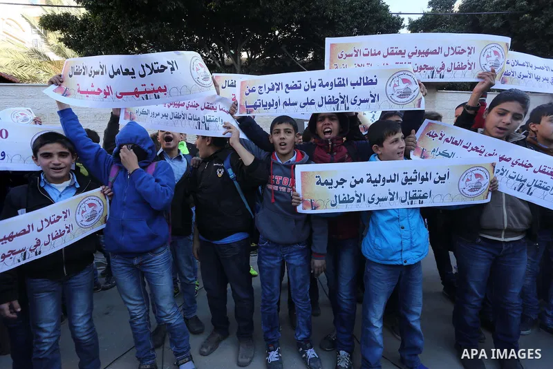 Palestinians take part in a protest demanding release the prisoners in Israeli jails, in front of Red cross office, in Gaza city, on Dec. 07, 2015. Photo by Mohammed Asad