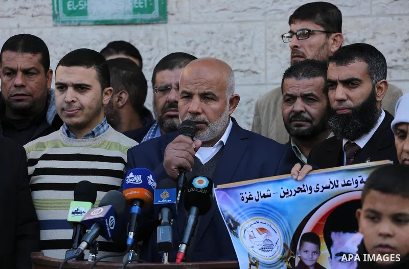 Palestinians take part in a protest demanding release the prisoners in Israeli jails, in front of Red cross office, in Gaza city, on Dec. 07, 2015. Photo by Mohammed Asad