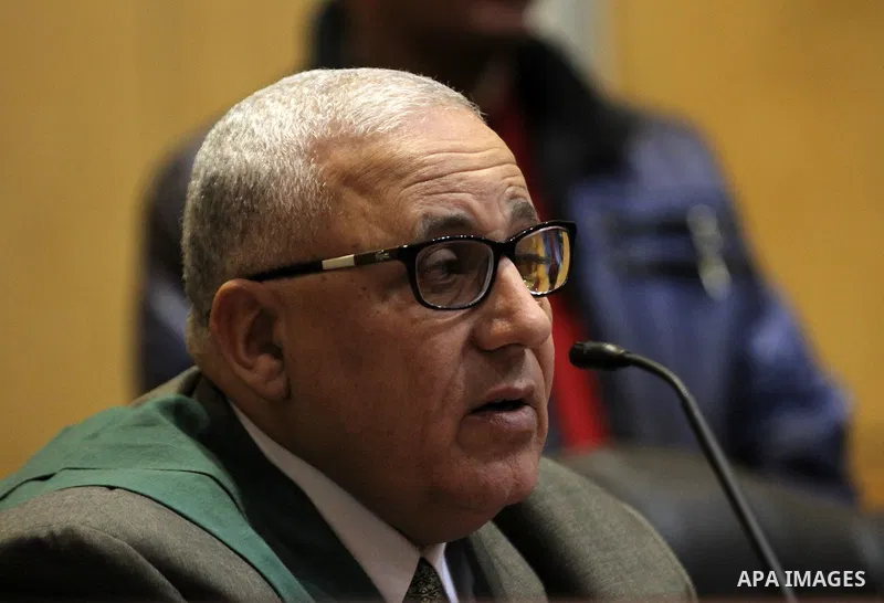 An Egyptian Judge attend the trial of Egyptian Muslim Brotherhood leader Mohammed Badie at a court in the outskirts of Cairo, Egypt, Dec. 07, 2015. Photo by Amr Sayed