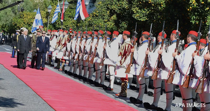 Egyptian President Abdel-Fattah al-Sisi and Greek President Prokopis Pavlopoulos review the honor guard during a welcome ceremony in Athens, Dec. 8, 2015. Egyptian President Abdel-Fattah al-Sisi arrived in Athens to atte...