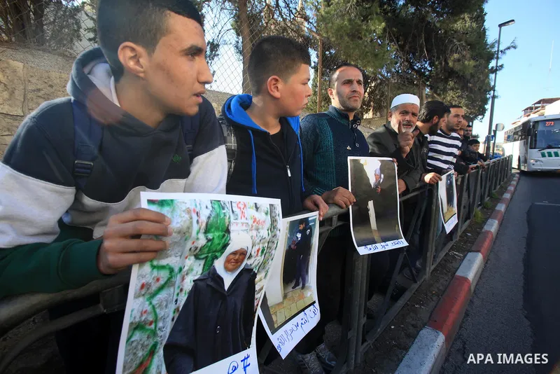 Palestinian take part during a protest to show solidarity with Palestinian prisoner Zeenat Jallad, 62, in occupied Jerusalem on Dec. 10, 2015. Photo by Mahfouz Abu Turk