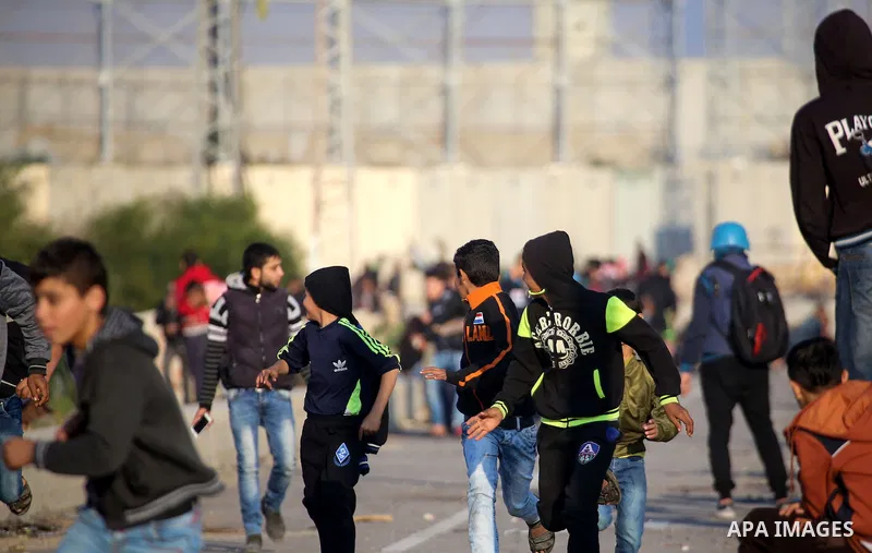 Palestinian protesters clash with Israeli security forces at the Erez crossing checkpoint in the northern Gaza Strip on Dec. 11, 2015. A Palestinian was shot dead and 12 wounded in clashes with Israeli forces on the bord...