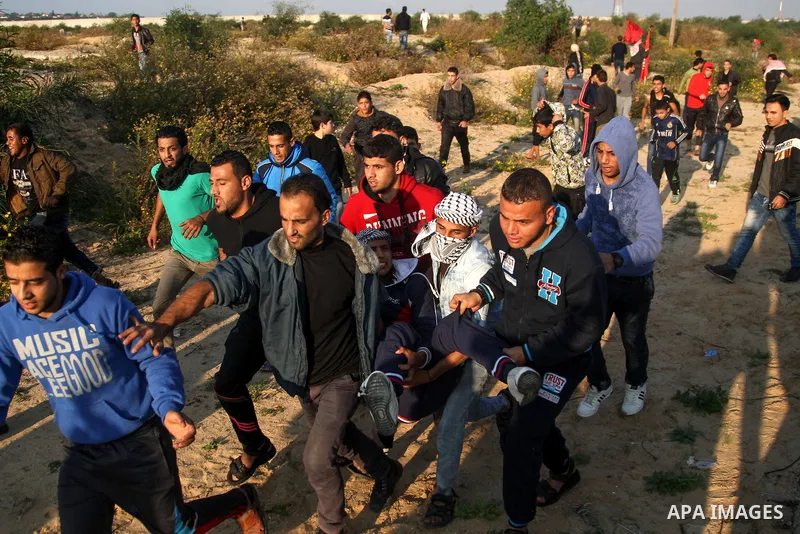 Palestinian protesters clash with Israeli security forces at the Erez crossing checkpoint in the northern Gaza Strip on Dec. 11, 2015. A Palestinian was shot dead and 12 wounded in clashes with Israeli forces on the bord...