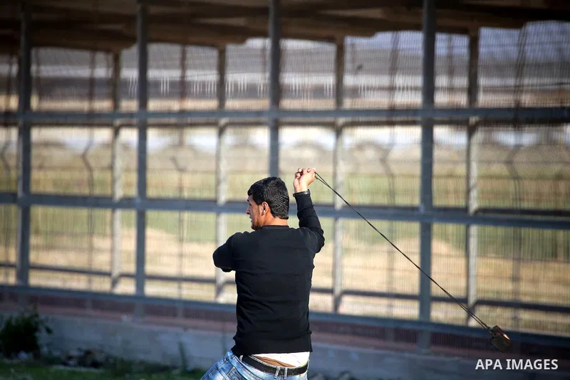 Palestinian protesters clash with Israeli security forces at the Erez crossing checkpoint in the northern Gaza Strip on Dec. 11, 2015. A Palestinian was shot dead and 12 wounded in clashes with Israeli forces on the bord...