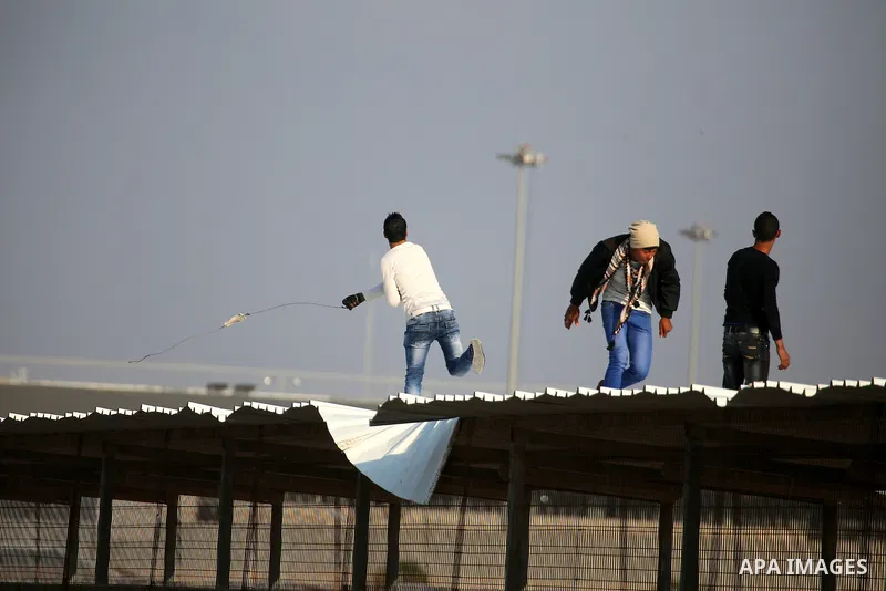 Palestinian protesters clash with Israeli security forces at the Erez crossing checkpoint in the northern Gaza Strip on Dec. 11, 2015. A Palestinian was shot dead and 12 wounded in clashes with Israeli forces on the bord...