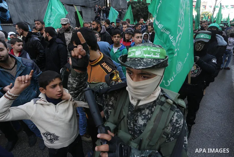 Palestinians take part in a rally marking the 28th anniversary of Hamas' founding, in Gaza City December 14, 2015. Photo by Mohammed Asad