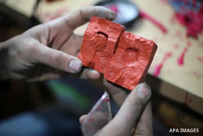 A Palestinian silver jeweler designs silver rings at his workshop in Gaza city on Dec. 16, 2015. Photo by Mohammed Asad