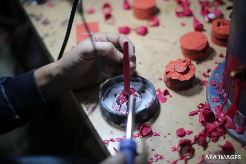 A Palestinian silver jeweler designs silver rings at his workshop in Gaza city on Dec. 16, 2015. Photo by Mohammed Asad