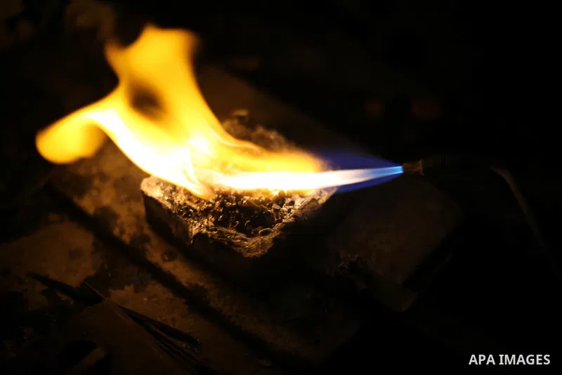 A Palestinian silver jeweler designs silver rings at his workshop in Gaza city on Dec. 16, 2015. Photo by Mohammed Asad