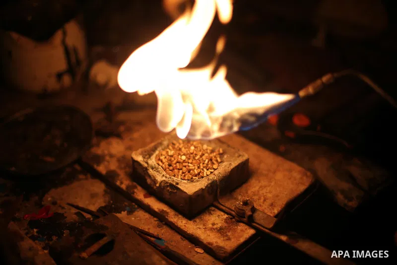 A Palestinian silver jeweler designs silver rings at his workshop in Gaza city on Dec. 16, 2015. Photo by Mohammed Asad