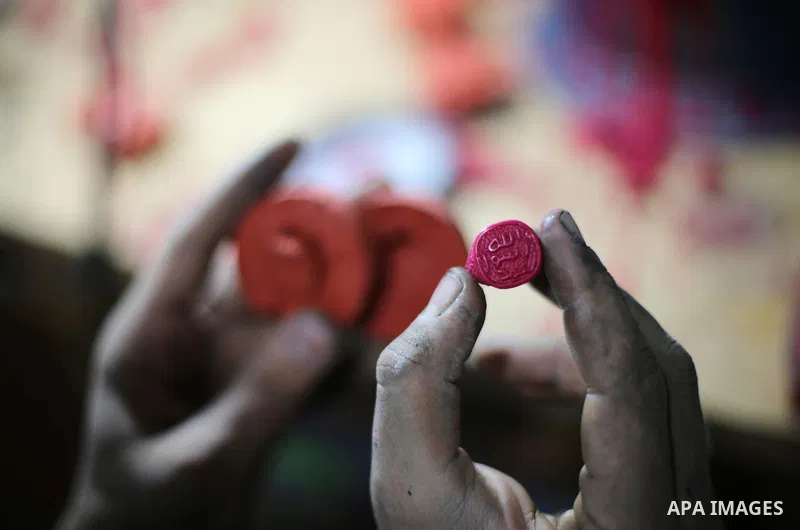 A Palestinian silver jeweler designs silver rings at his workshop in Gaza city on Dec. 16, 2015. Photo by Mohammed Asad