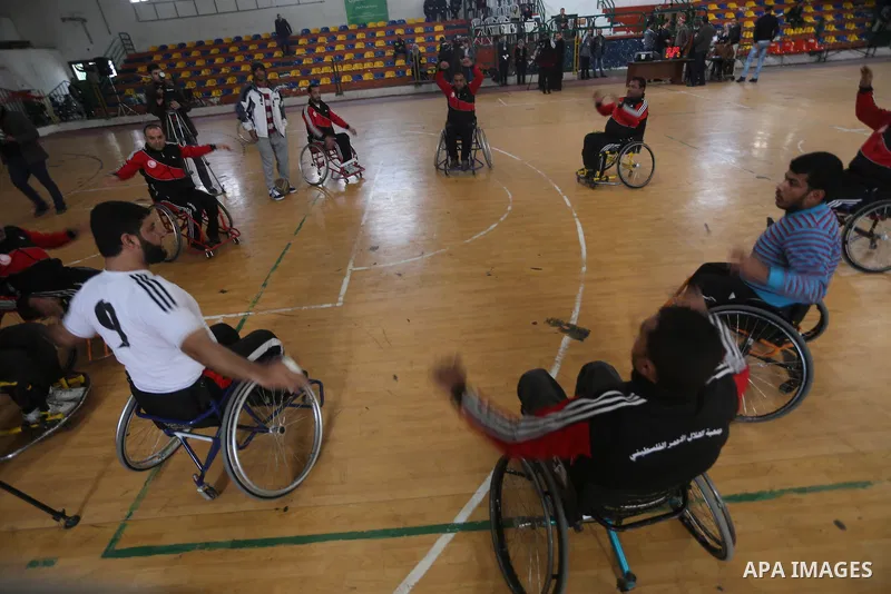 Disabled Palestinians take part in a local wheelchair basketball championship sponsored by the International Committee of the Red Cross (ICRC) in Gaza City December 17, 2015. Photo by Mohammed Asad
