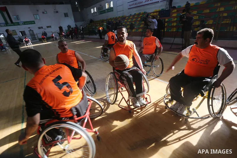 Disabled Palestinians take part in a local wheelchair basketball championship sponsored by the International Committee of the Red Cross (ICRC) in Gaza City December 17, 2015. Photo by Mohammed Asad