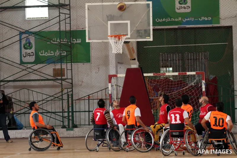 Disabled Palestinians take part in a local wheelchair basketball championship sponsored by the International Committee of the Red Cross (ICRC) in Gaza City December 17, 2015. Photo by Mohammed Asad