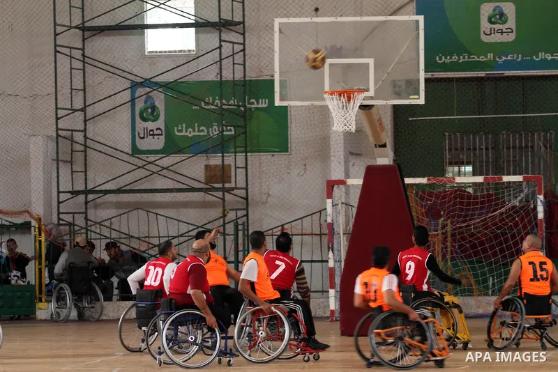 Disabled Palestinians take part in a local wheelchair basketball championship sponsored by the International Committee of the Red Cross (ICRC) in Gaza City December 17, 2015. Photo by Mohammed Asad