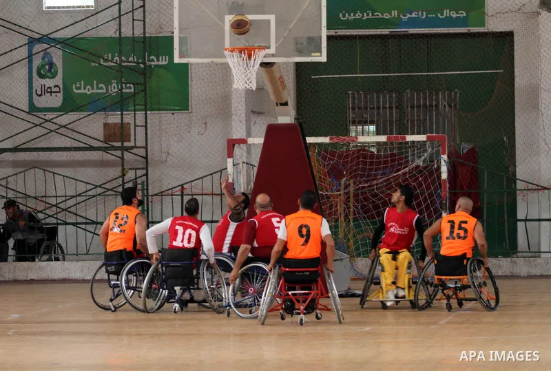 Disabled Palestinians take part in a local wheelchair basketball championship sponsored by the International Committee of the Red Cross (ICRC) in Gaza City December 17, 2015. Photo by Mohammed Asad