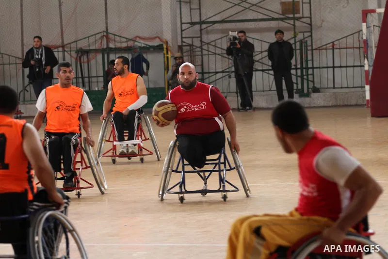 Disabled Palestinians take part in a local wheelchair basketball championship sponsored by the International Committee of the Red Cross (ICRC) in Gaza City December 17, 2015. Photo by Mohammed Asad