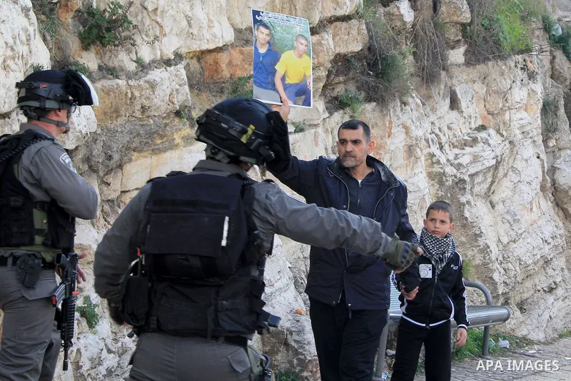 Israeli security forces stand guard and attempt to disperse Palestinian protesters outside Damascus Gate in Jerusalem's old city following a demonstration demanding Israeli authorities to return the bodies of alleged Pal...