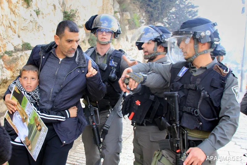 Israeli security forces stand guard and attempt to disperse Palestinian protesters outside Damascus Gate in Jerusalem's old city following a demonstration demanding Israeli authorities to return the bodies of alleged Pal...