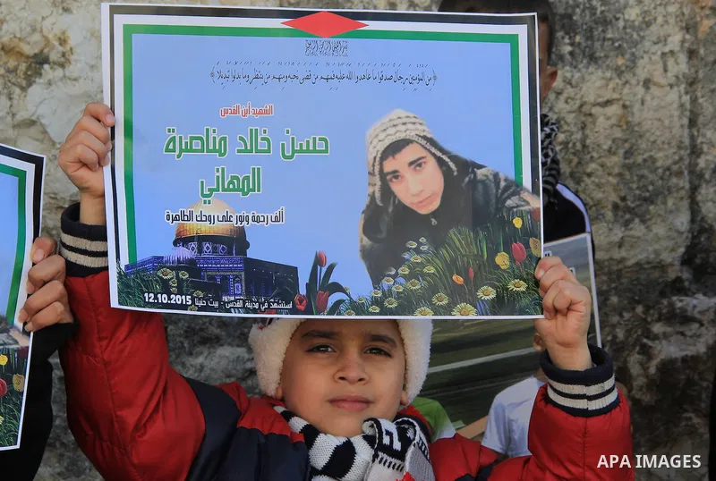 Palestinians take part in a demonstration demanding Israeli authorities to return the bodies of alleged Palestinian attackers outside Damascus Gate in Jerusalem's old city, on December 26, 2015. Photo by Mahfouz Abu Turk