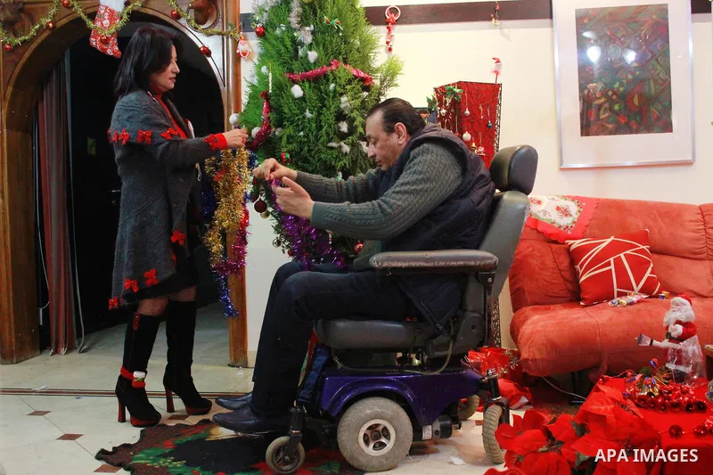 An Egyptian Christian family decorate a Christmas tree at their house in Cairo, Egypt on Dec. 30, 2015. Photo by Amr Sayed