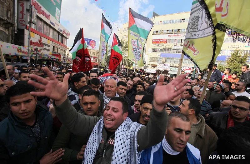 Mourners carry the body of Palestinian Baseem Salah, 38-year-old during his funeral in the West Bank city of Nablus on Dec. 30, 2015. Salah was killed Nov. 30 after an attack left an Israeli police officer wounded in Jer...