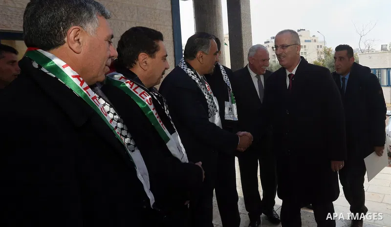 Palestinian Prime Minister Rami Hamdallah attends the Palestinian Teacher Day ceremony in the West bank city of Ramallah on Dec. 30, 2015. Photo by Prime Minister Office