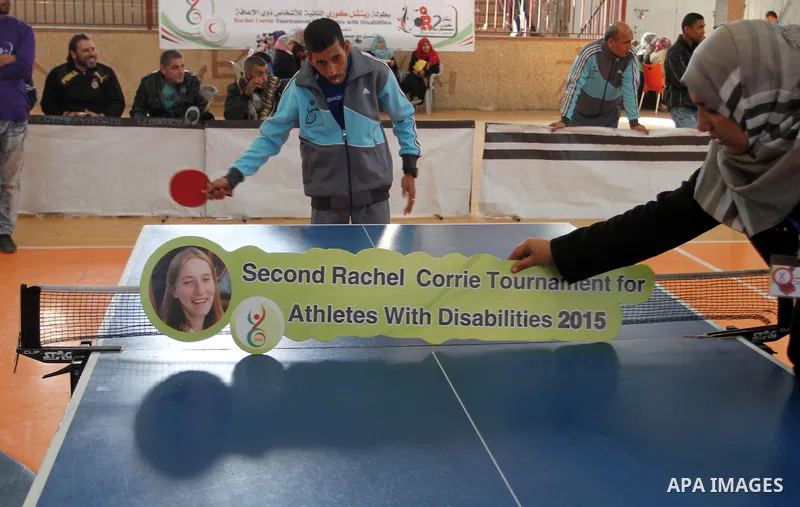 Disabled Palestinians play table tennis during the second Rachel Corrie Championship in Khan Younis in the southern Gaza strip on Dec. 30, 2015. Corrie, an American activist for the International Solidarity Movement (ISM...