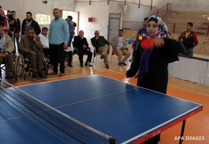 Disabled Palestinians play table tennis during the second Rachel Corrie Championship in Khan Younis in the southern Gaza strip on Dec. 30, 2015. Corrie, an American activist for the International Solidarity Movement (ISM...