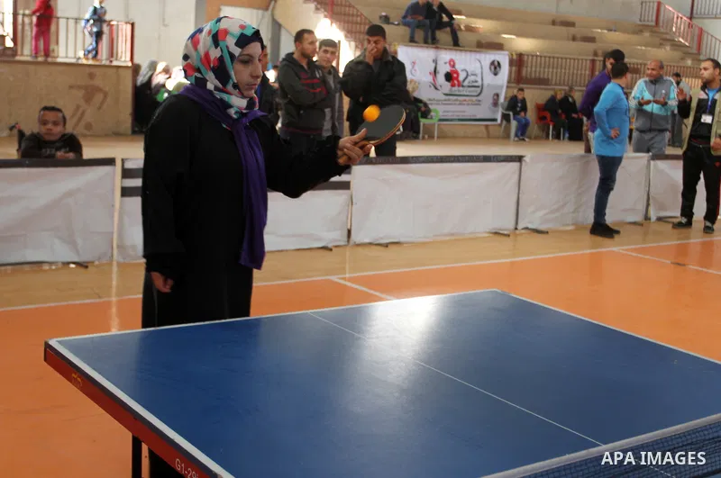 Disabled Palestinians play table tennis during the second Rachel Corrie Championship in Khan Younis in the southern Gaza strip on Dec. 30, 2015. Corrie, an American activist for the International Solidarity Movement (ISM...