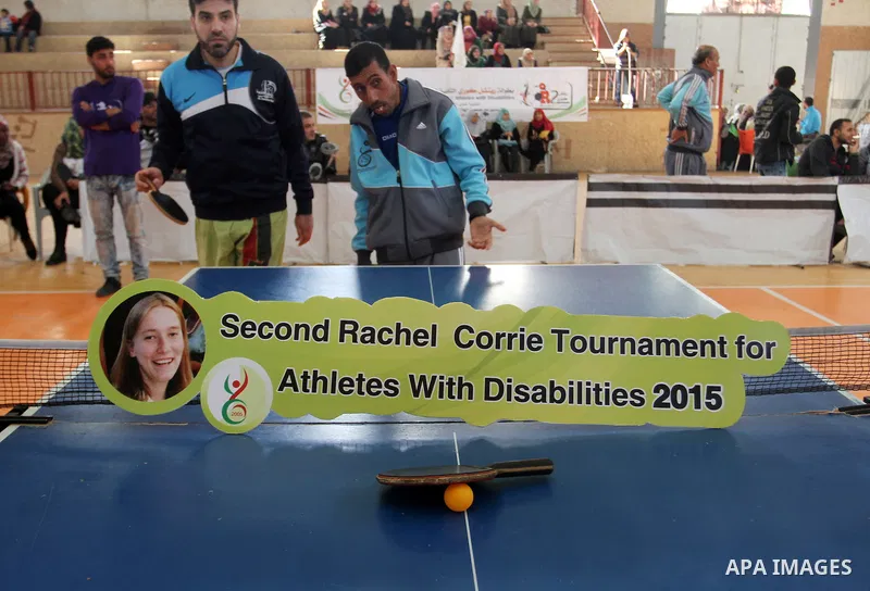 Disabled Palestinians play table tennis during the second Rachel Corrie Championship in Khan Younis in the southern Gaza strip on Dec. 30, 2015. Corrie, an American activist for the International Solidarity Movement (ISM...