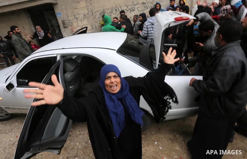Relatives mourn during the funeral of Ishaq Hassan, 28, who was shot dead by Egyptian border guards as he crossed from the Gaza Strip into Egypt, on December 31, 2015 in Gaza city. Ishaq Hassan, who was said to suffer fr...