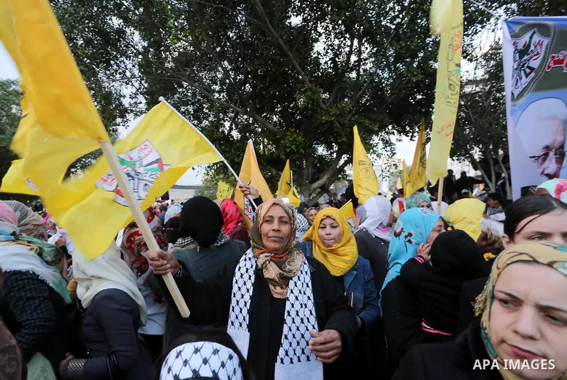 Palestinian Fatah supporters celebrate during a rally as they mark the 51st anniversary of the founding of the Fatah movement, in Gaza City December 31, 2015. Photo by Mohammed Asad