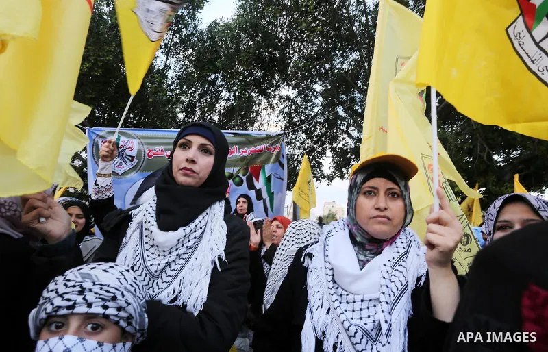 Palestinian Fatah supporters celebrate during a rally as they mark the 51st anniversary of the founding of the Fatah movement, in Gaza City December 31, 2015. Photo by Mohammed Asad