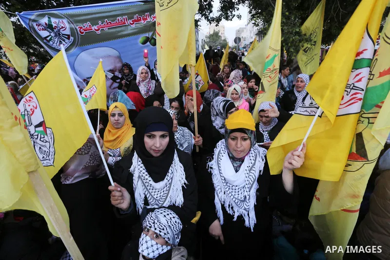 Palestinian Fatah supporters celebrate during a rally as they mark the 51st anniversary of the founding of the Fatah movement, in Gaza City December 31, 2015. Photo by Mohammed Asad