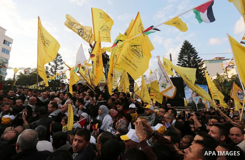 Palestinian Fatah supporters celebrate during a rally as they mark the 51st anniversary of the founding of the Fatah movement, in Gaza City December 31, 2015. Photo by Mohammed Asad
