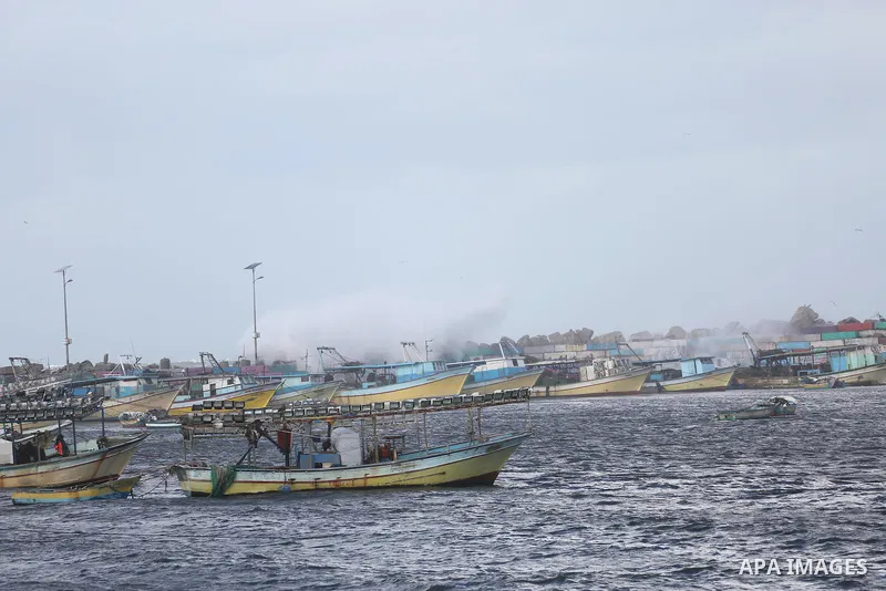 A Picture shows waves crash fishermen's harbor at the beach of Gaza city on the first day of the new year on Jan. 01, 2016. Photo by Mohammed Asad