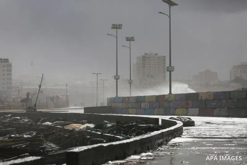 A Picture shows waves crash fishermen's harbor at the beach of Gaza city on the first day of the new year on Jan. 01, 2016. Photo by Mohammed Asad