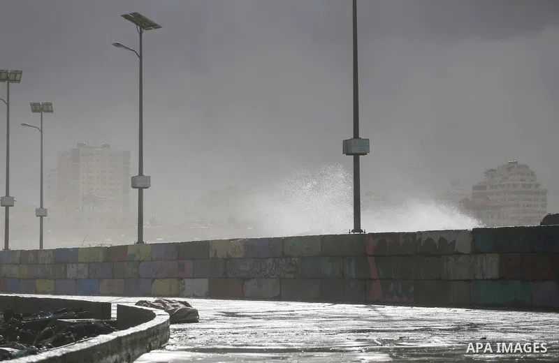 A Picture shows waves crash fishermen's harbor at the beach of Gaza city on the first day of the new year on Jan. 01, 2016. Photo by Mohammed Asad