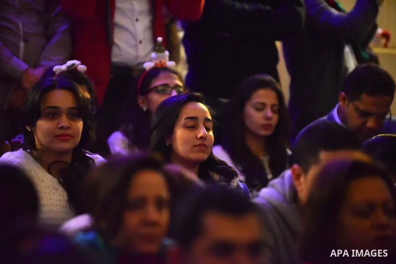 Egyptian Christians take part in a prayer during celebrations of Christmas and New Year festivities, at Kasr el-Dobara evangelical Church, in Cairo on Jan 01, 2016. Photo by Amr Sayed