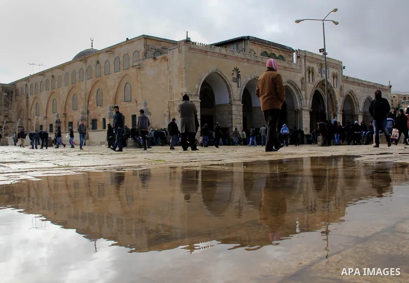 Palestinian Muslim worshipers walk in front of al-Aqsa mosque compound following Friday prayers at al-Aqsa mosque, Islam's third holiest site, in Jerusalem's Old city on Jan. 01, 2016. Photo by Mahfouz Abu Turk